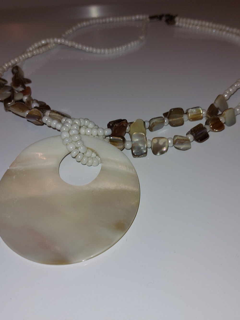 Artcoco Neutral Shell Disk Pendant Necklace with Brown Accent Beads